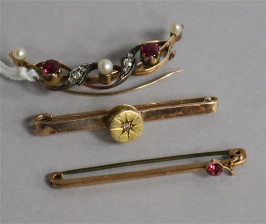 A diamond pearl and ruby demi lune bar brooch and two 9ct gold bar brooches.